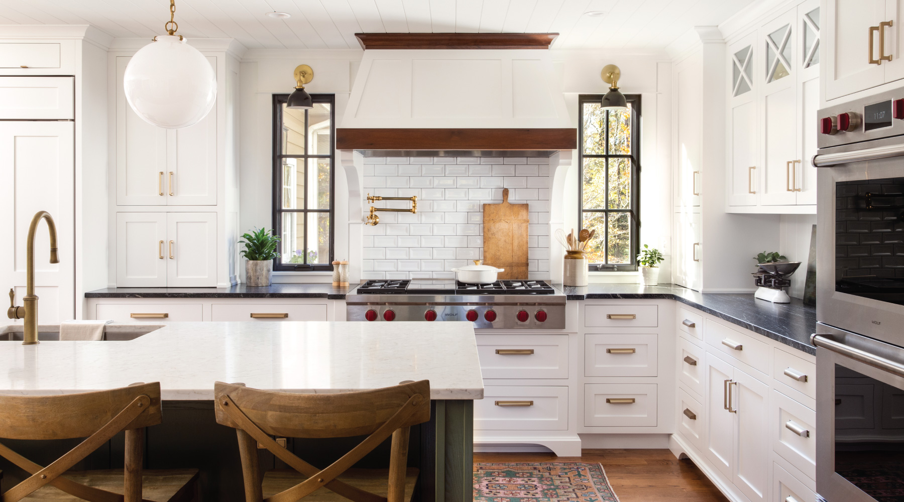 Kitchen with white cabinents, a black granite counter and stainless steel appliances